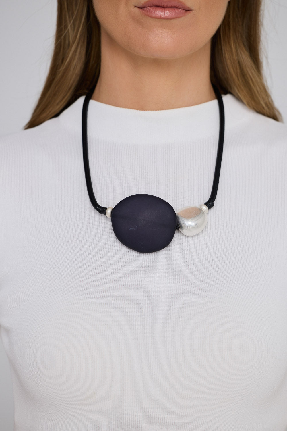 Stefani Choker in black with statement feature pendant, pendant close-up view.
