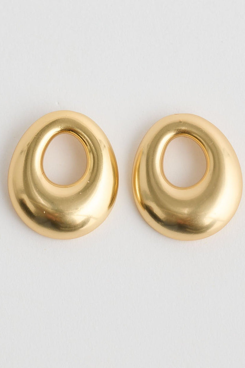 Brass cylindrical object on a white background