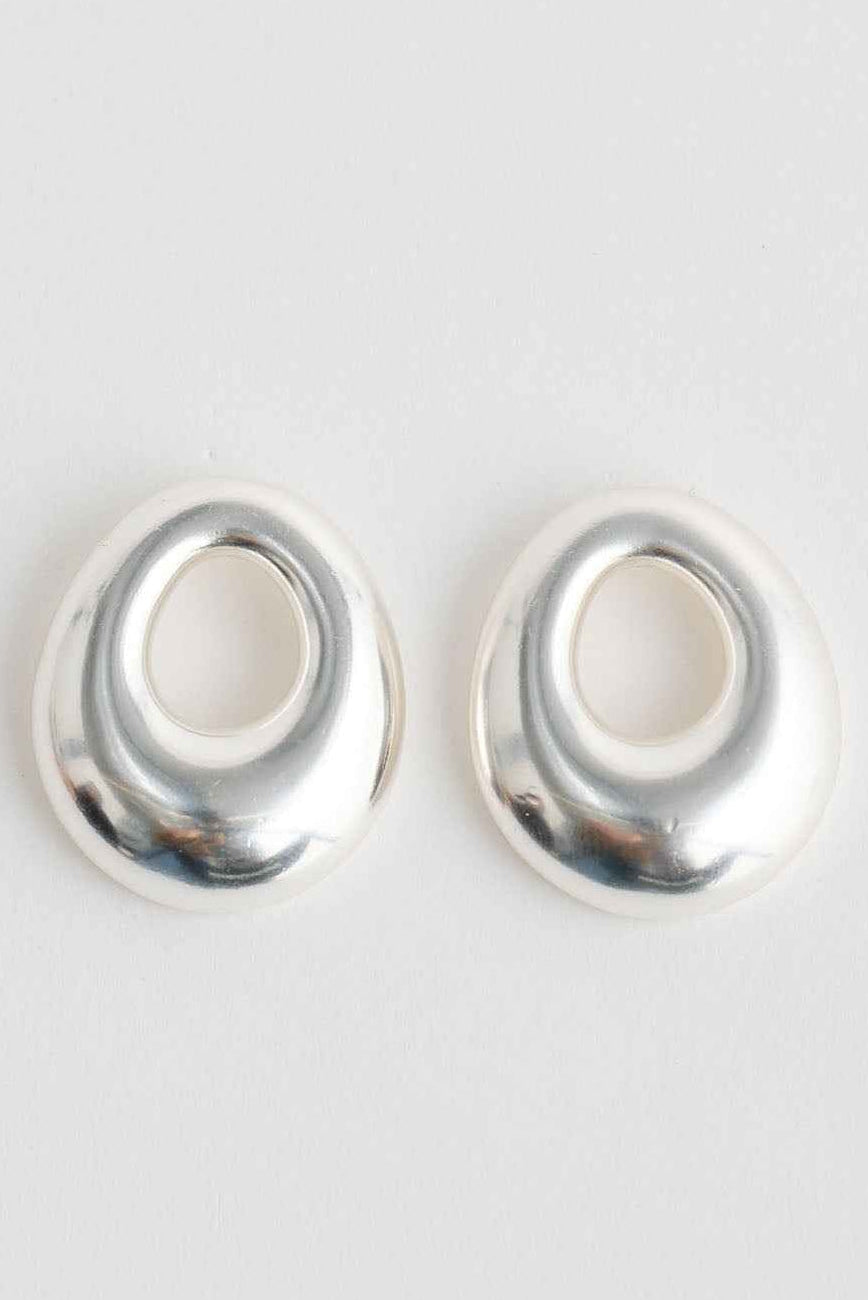 Brass cylindrical object on a white background