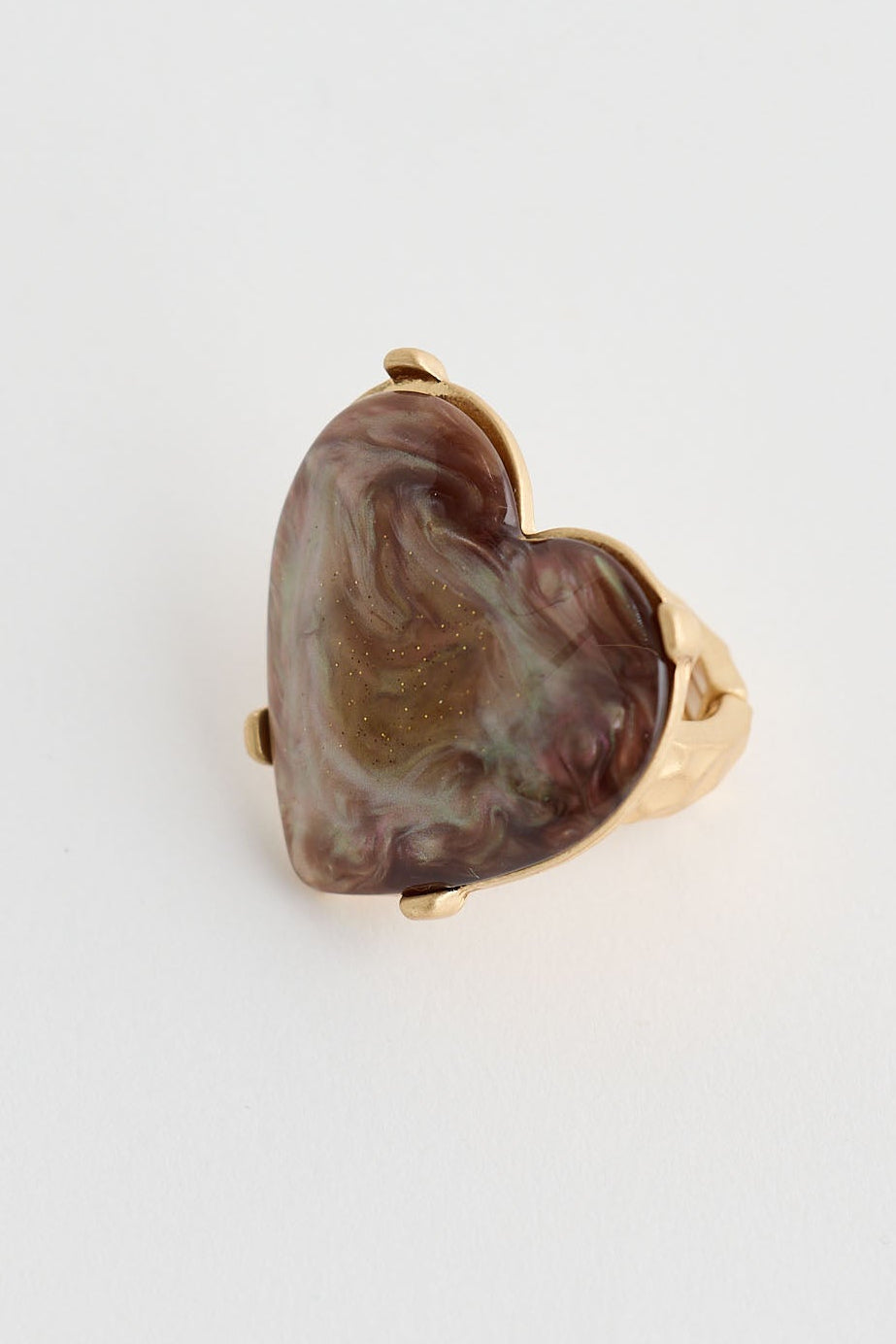 Heart-shaped stone ring on a white background