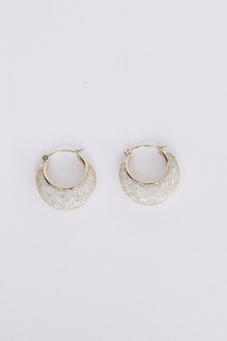 Model wearing Twilight Earrings in gunmetal with soft textured finish, close-up view.