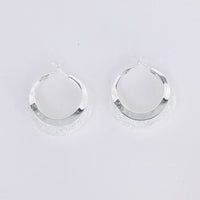 Eclipse Earrings in silver with soft textured finish, front view.
