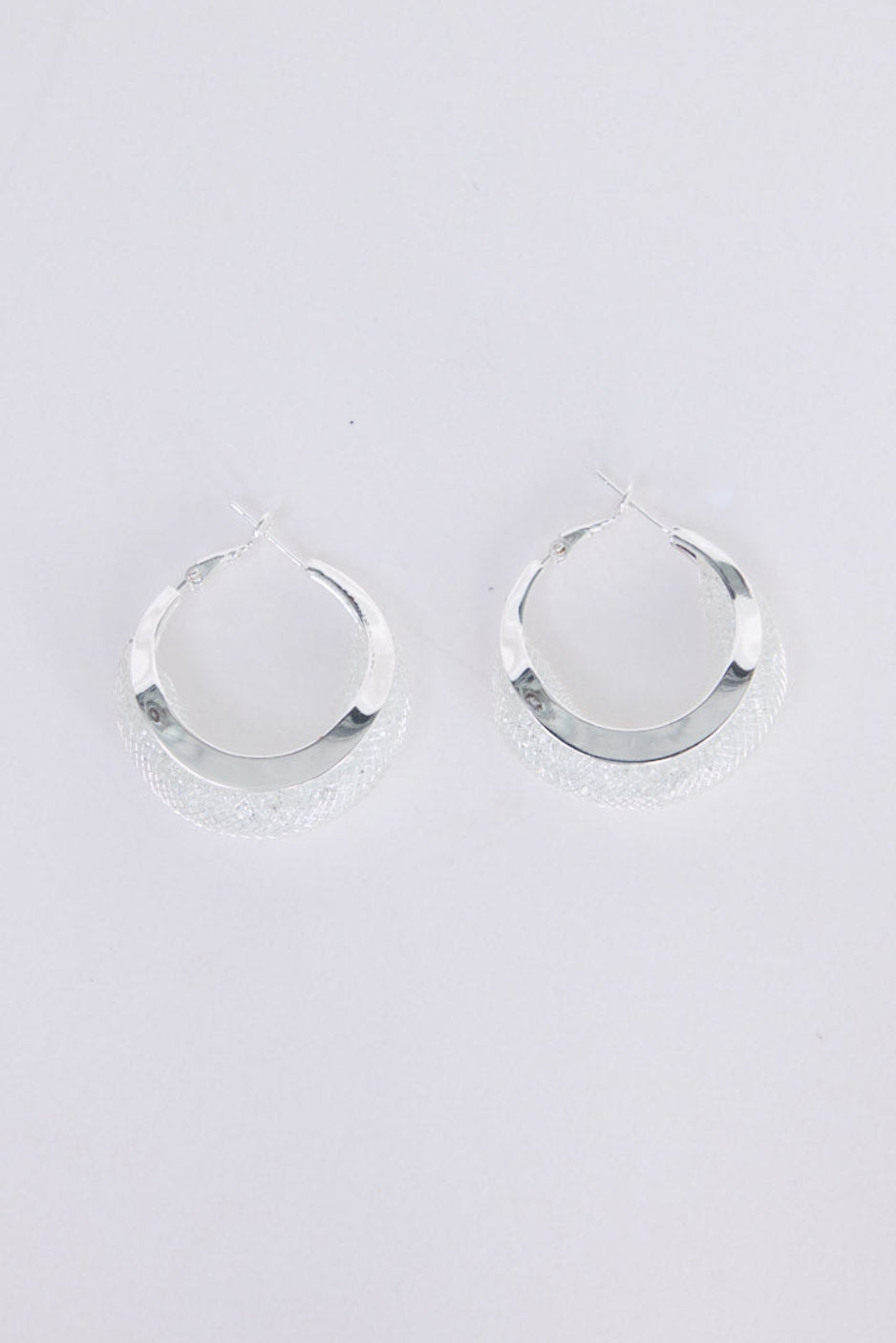 Eclipse Earrings in silver with soft textured finish, front view.
