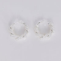 Opulence Earrings in silver with soft textured finish, front view.