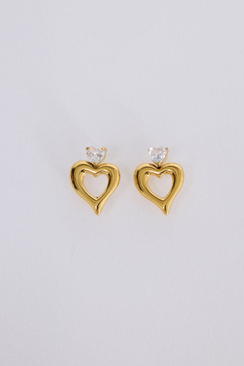 Beloved Earrings in gold with a soft sculptural finish, angled view.