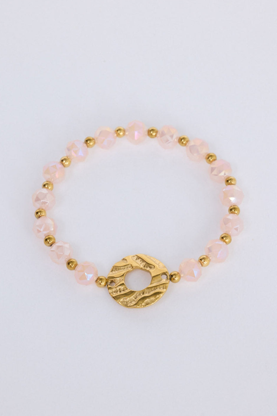 Clarke Bracelet in pink with statement gold charm detail, front view.
