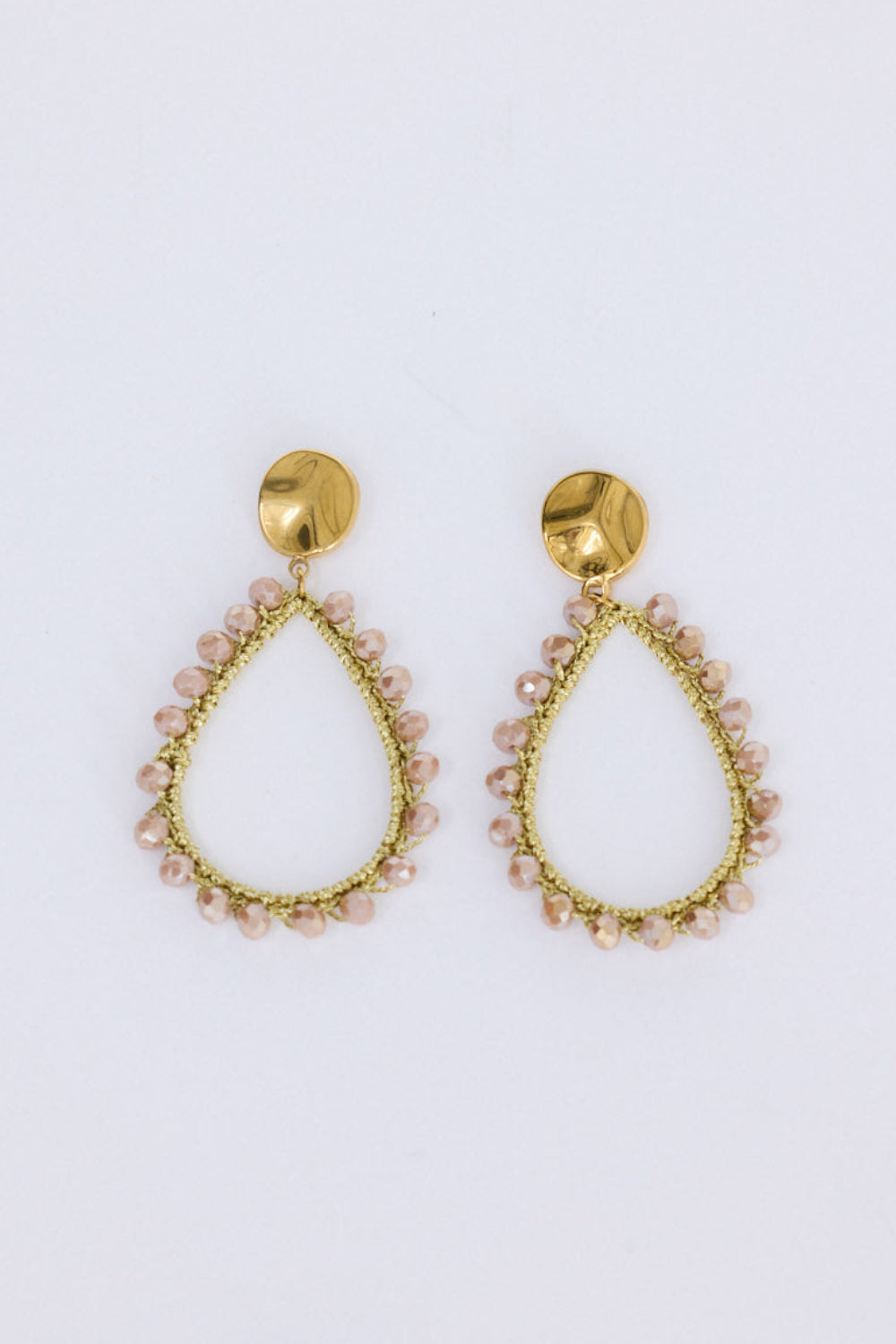Sawyer Earrings in blush with delicate beaded trim detailing, angled view.