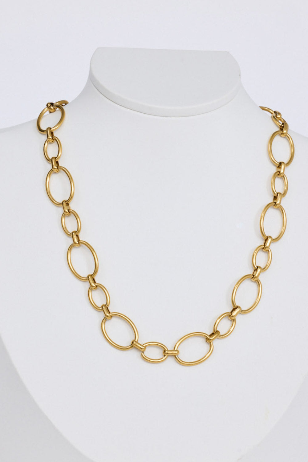 Lexi Necklace in gold with bold rounded link detailing, angled view.