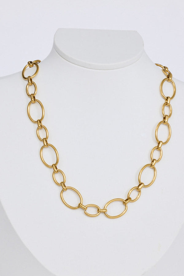 Lexi Necklace in gold with bold rounded link detailing, angled view.