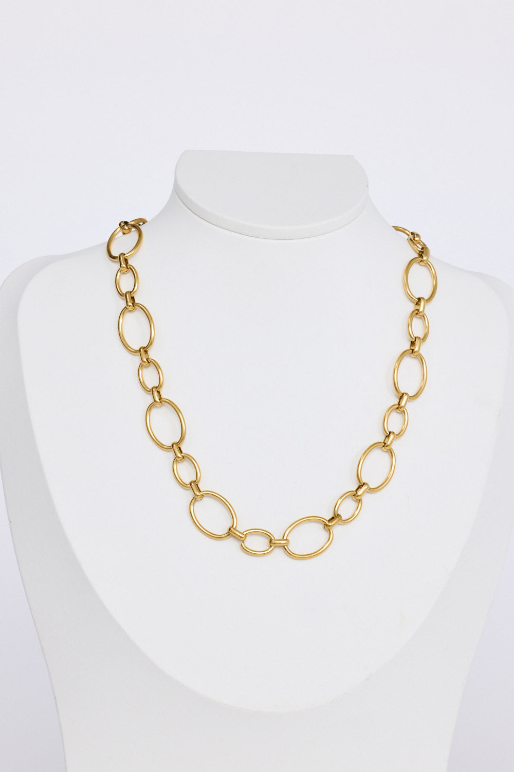 Lexi Necklace in gold with bold rounded link detailing, pendant close-up view.