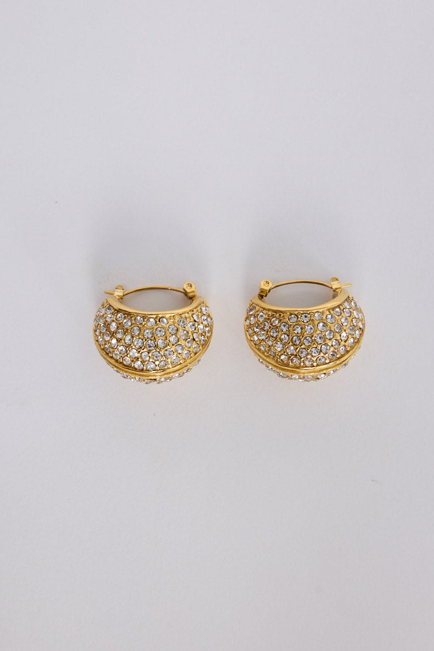 Elvana Earrings in gold with layered pave crystal detailing, angled view.