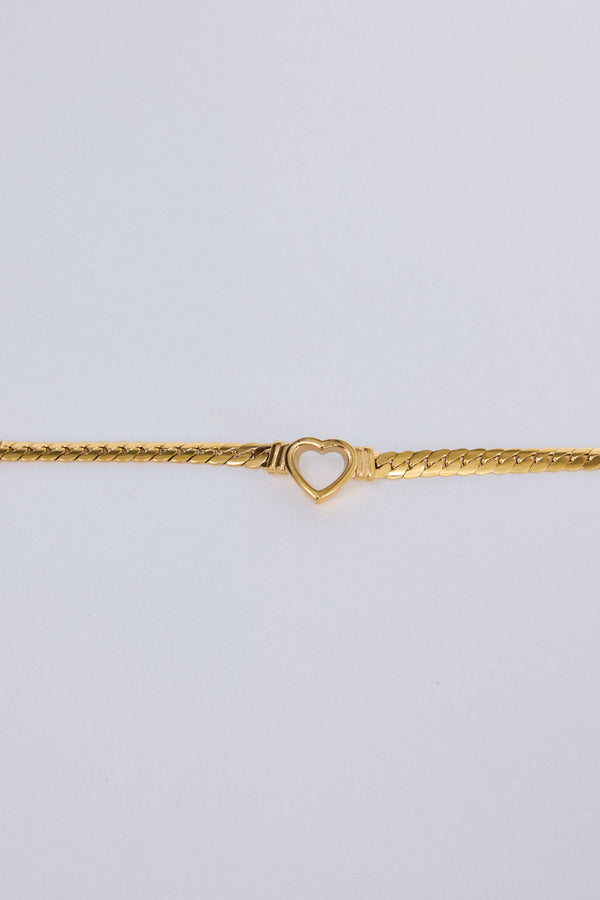 Hearts Bracelet in gold with delicate heart link detailing, flat lay detail view.