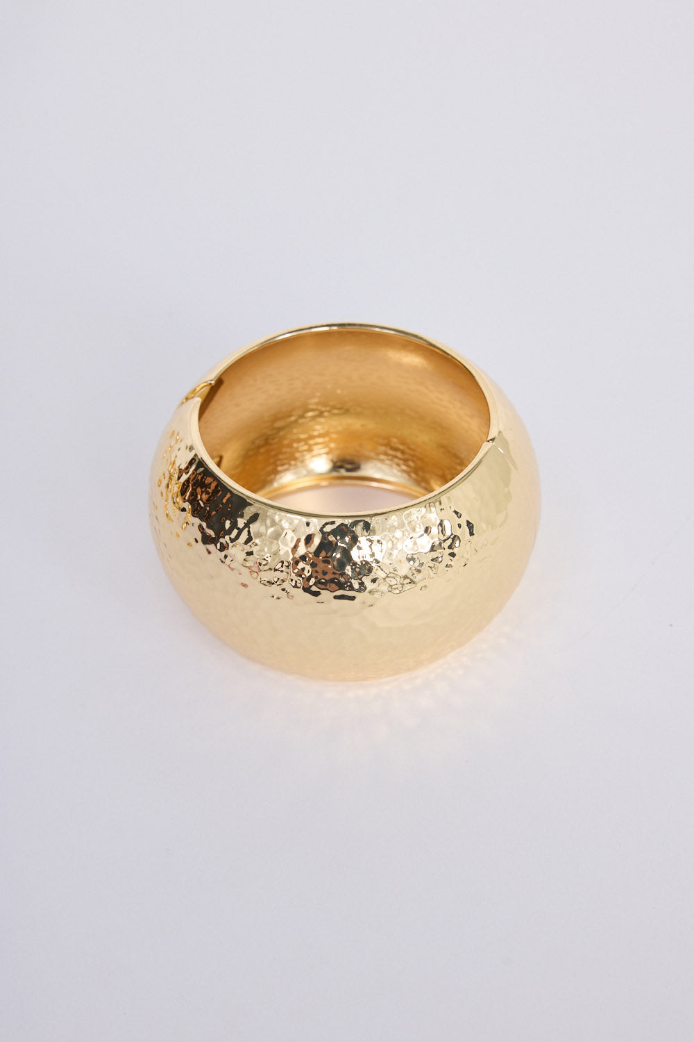 Maura Bangle in gold with snap lock closure and hinge for easy wear, detail view.