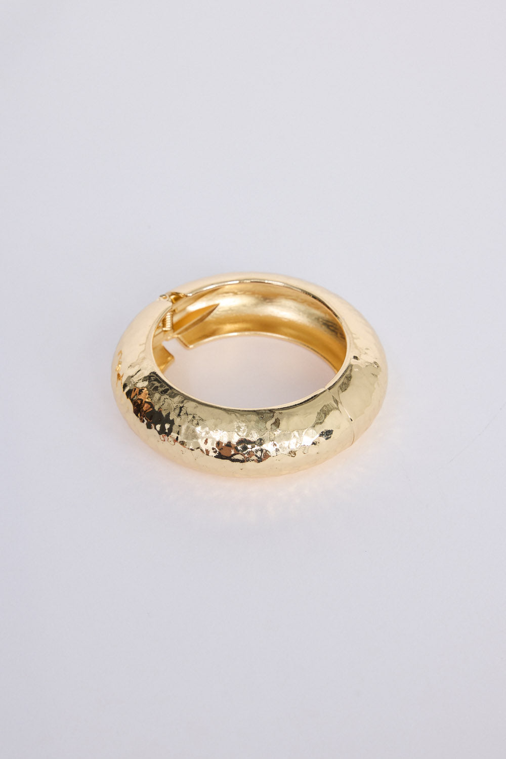 Seville Bangle in gold with snap lock closure and hinge for easy wear, front view.