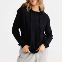 Model wearing Hush Knit Hoodie in black.