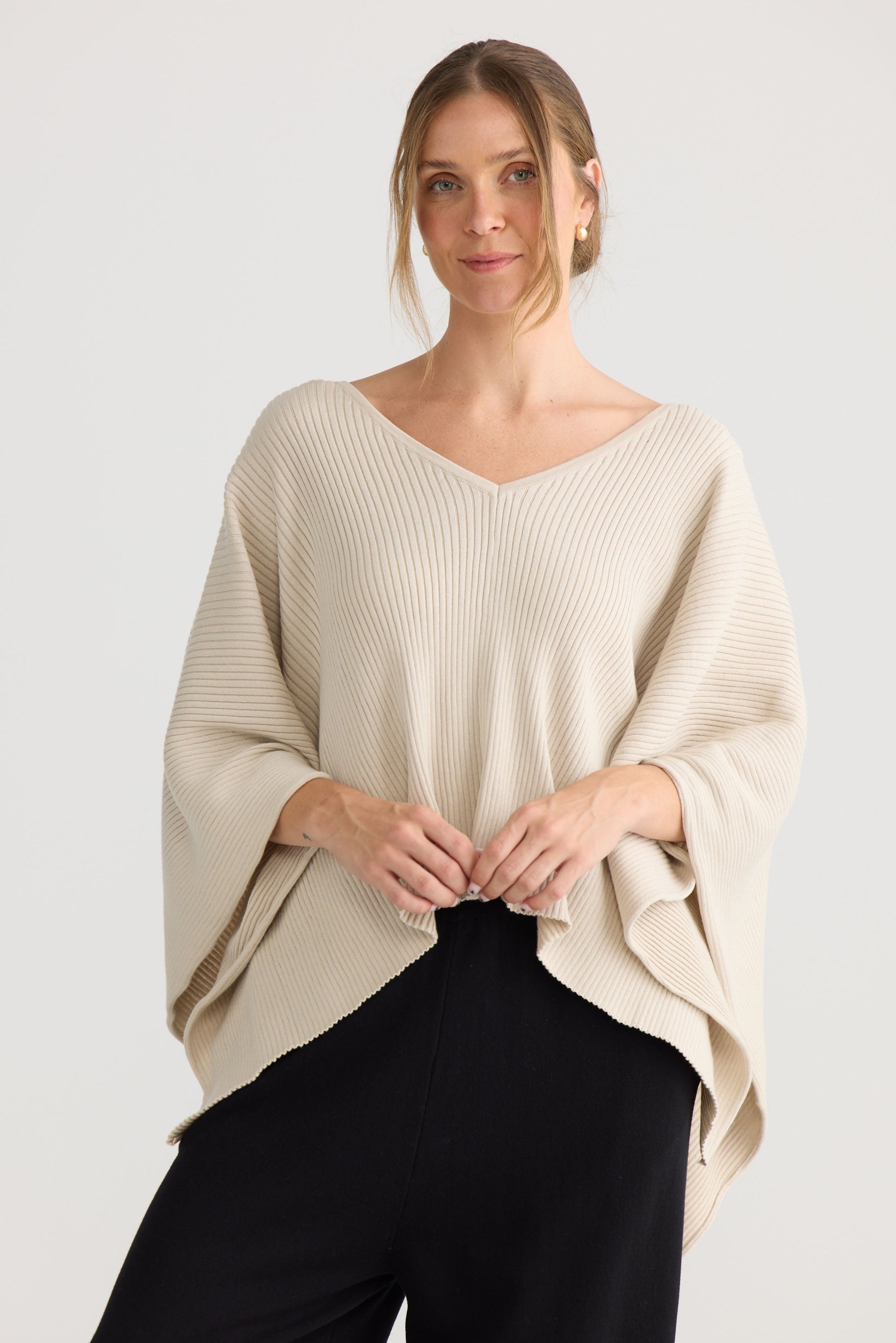 Affirm Cape in cream, showing draped cape shape.