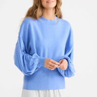 Model wearing Ember Knit in powder blue.