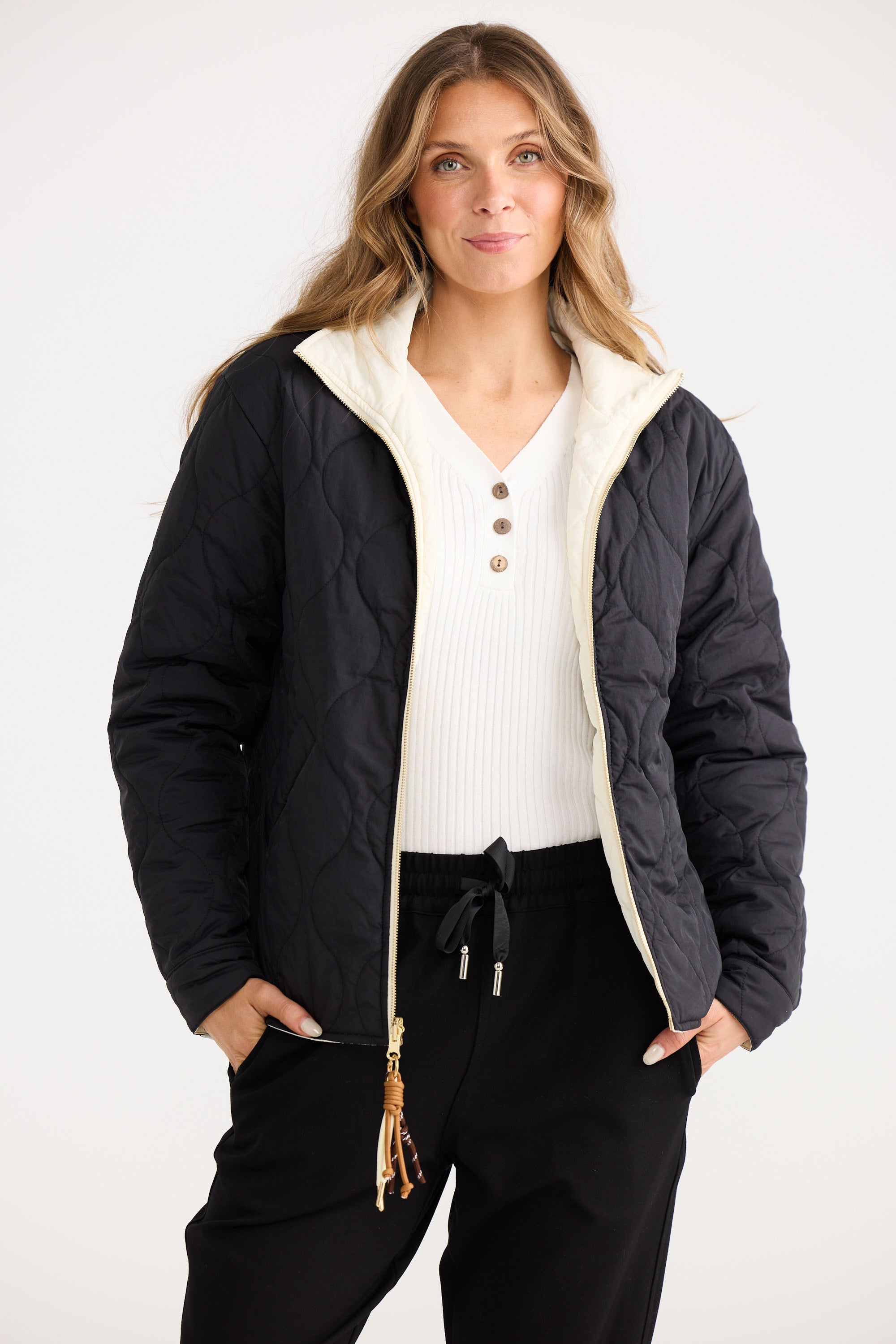 Model wearing Ellis Puffer in black with cream.