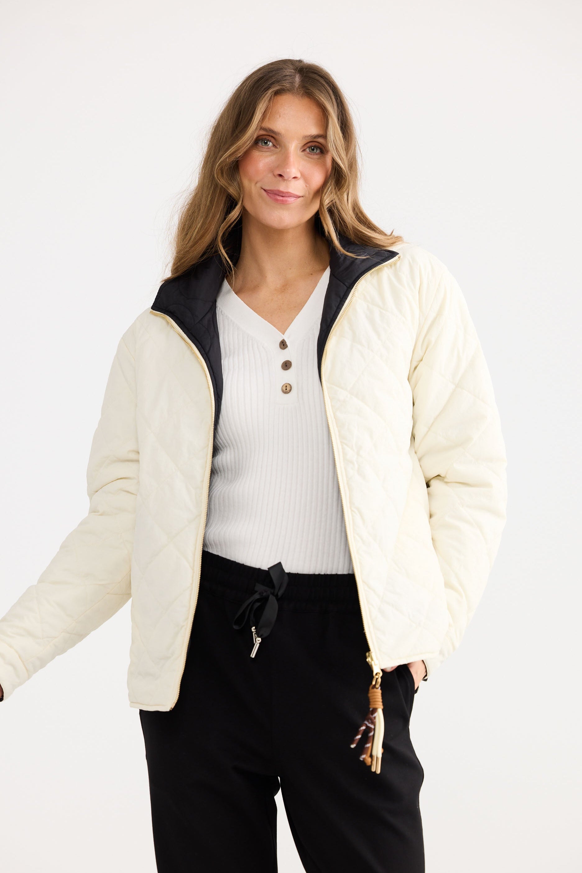 Ellis Puffer in black with cream, shown on model.