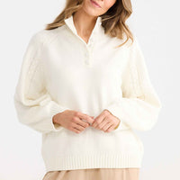 Model wearing Roomate Knit in white.