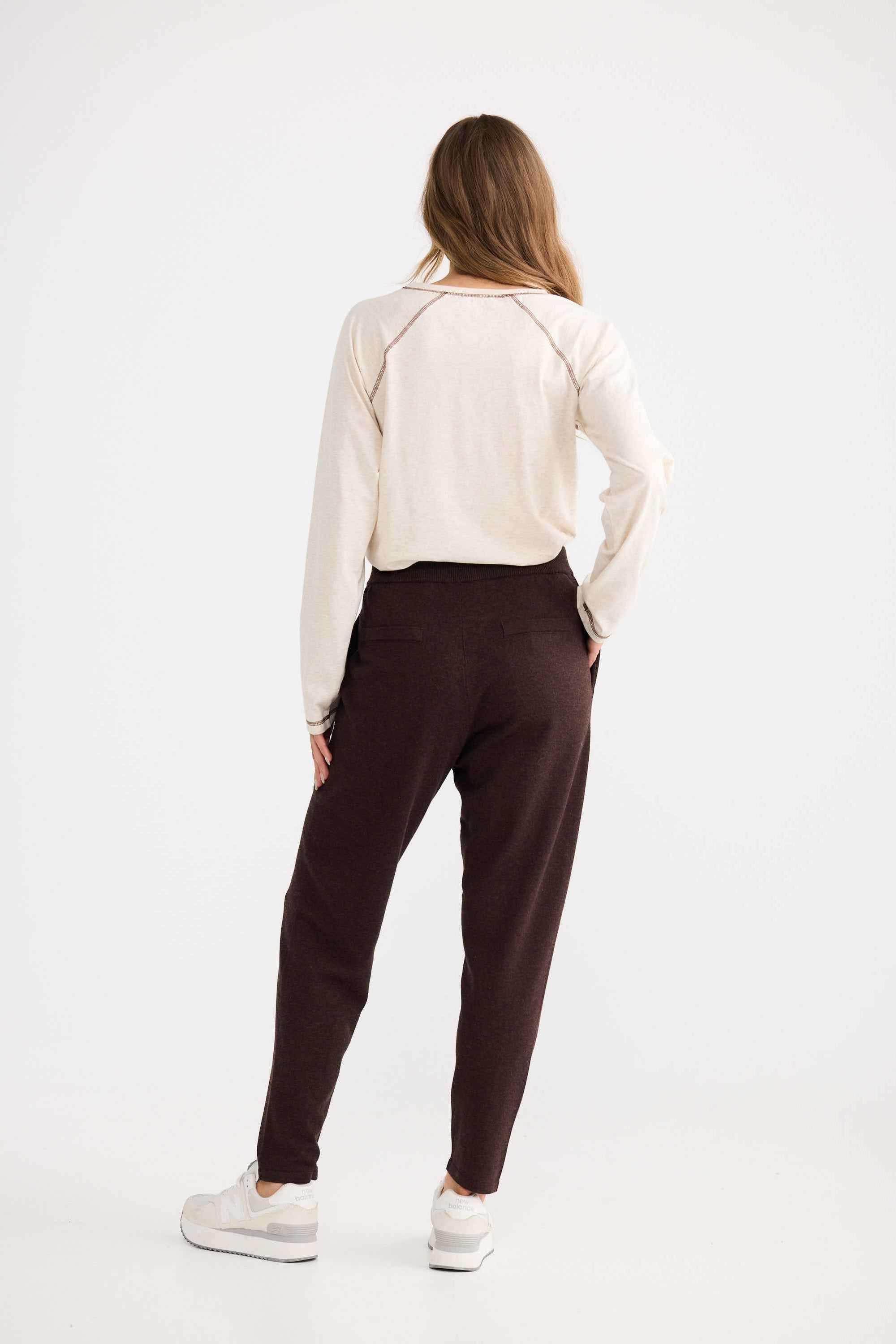 Model wearing Woodside Pant in chocolate, showing drawstring waist.