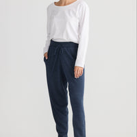Model wearing Woodside Pant in navy.