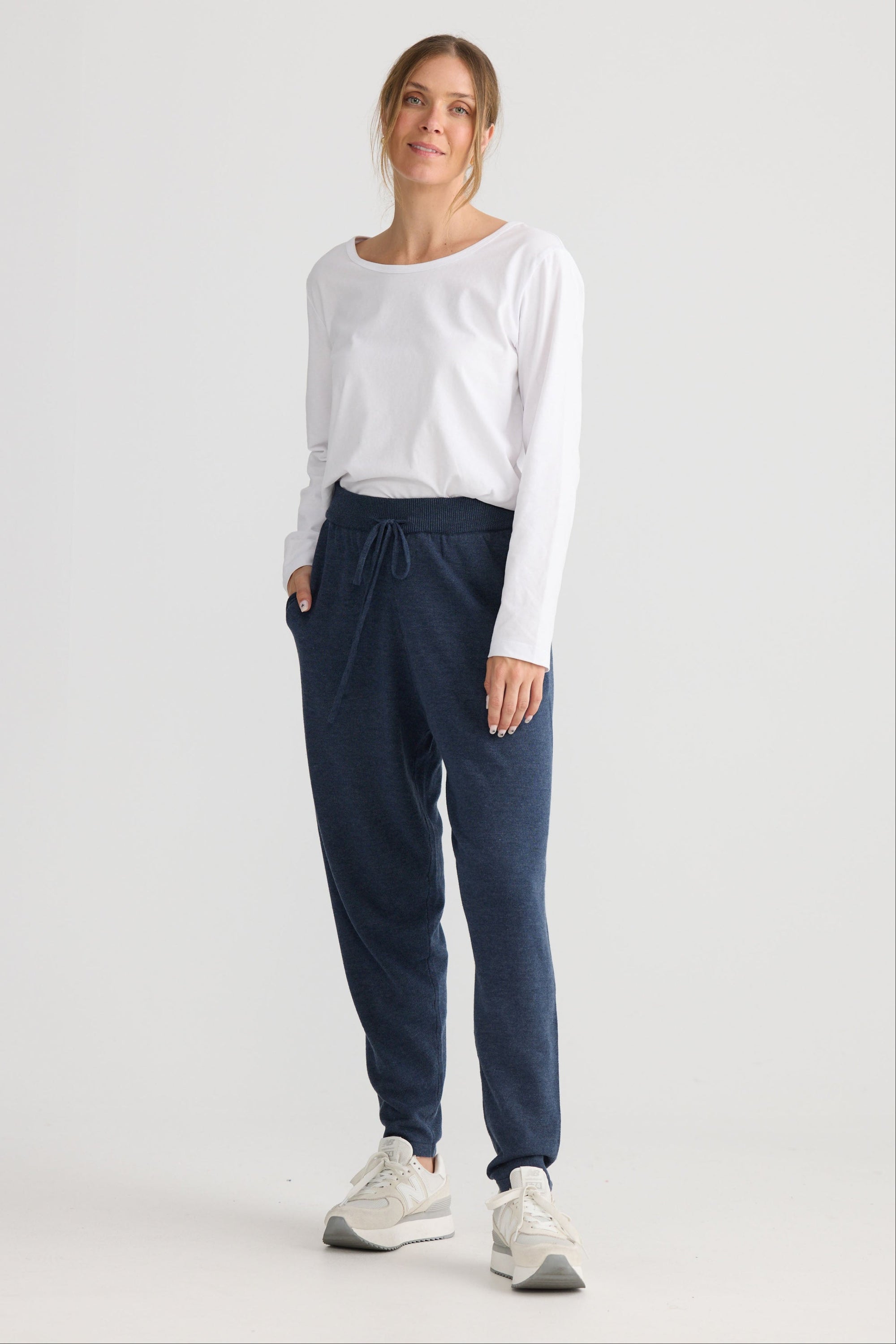 Model wearing Woodside Pant in navy.