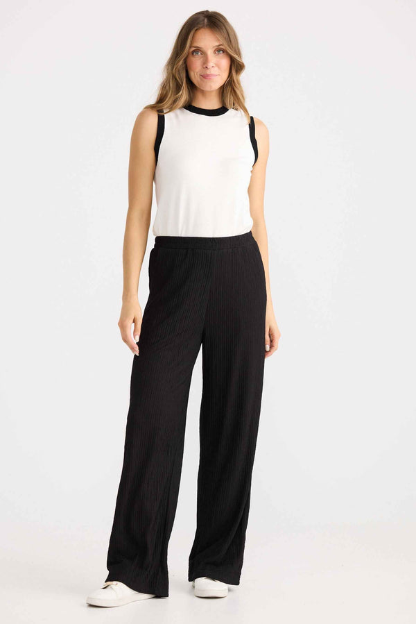 Model wearing Ivy Pant in black.
