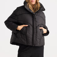 Model wearing Zella Puffer in black.