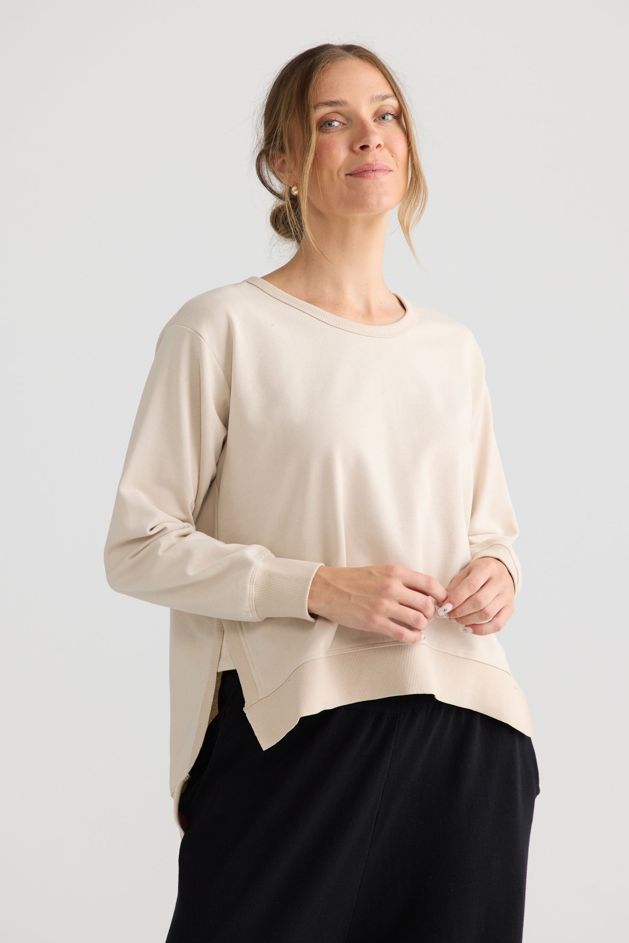 Model wearing Faye Lounge Jumper in oat.