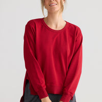 Faye Lounge Jumper in scarlet, styled with a relaxed outfit.