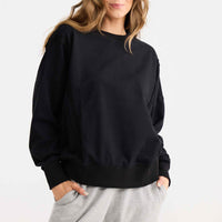 Model wearing Energy Sweater in black.