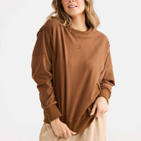 Model wearing Energy Sweater in chocolate.