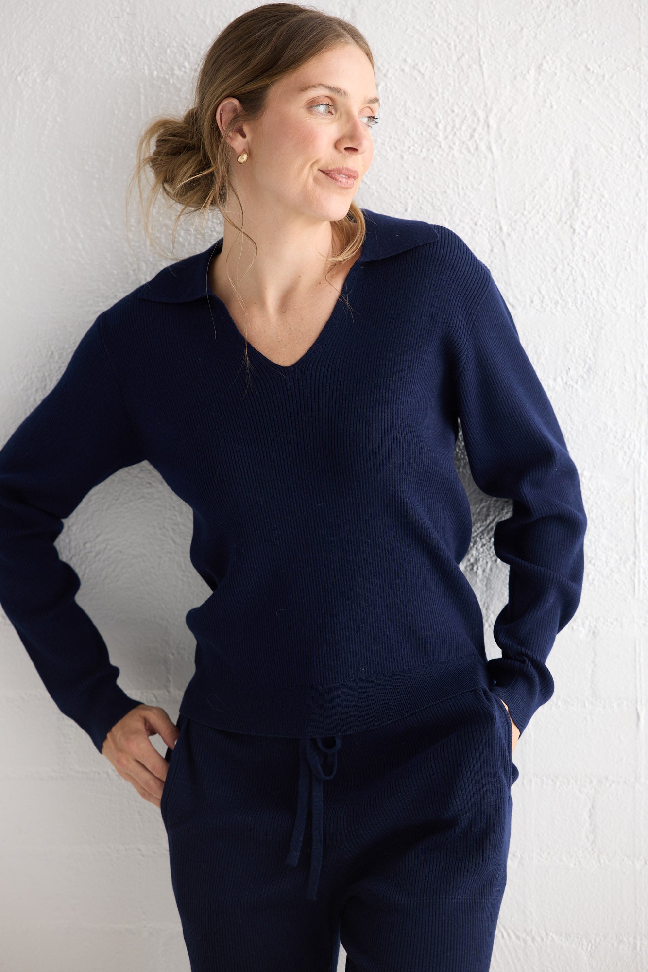 Campaign image of model wearing Tilda Top in navy.