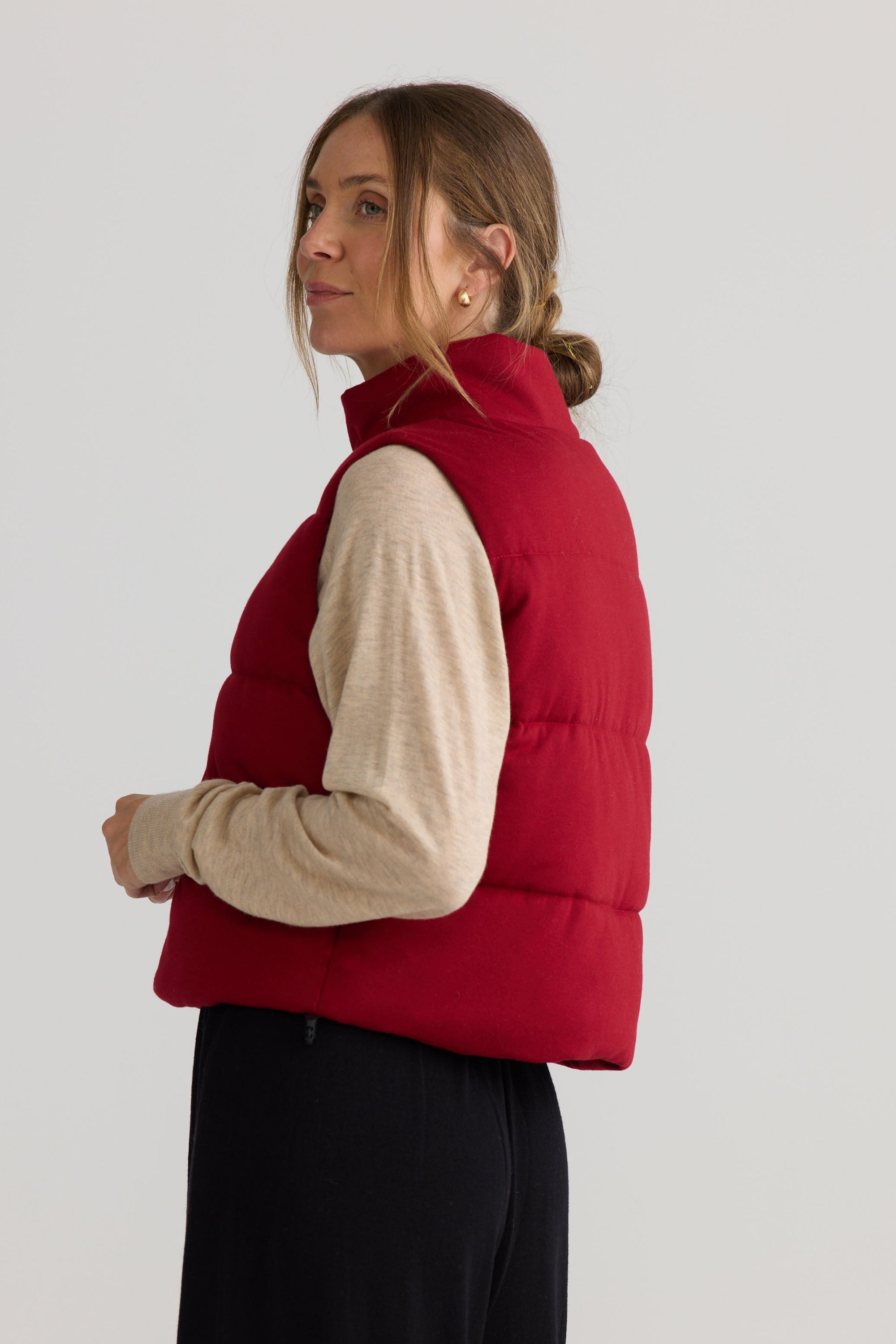 Tate Puffer Vest in red, shown on model.