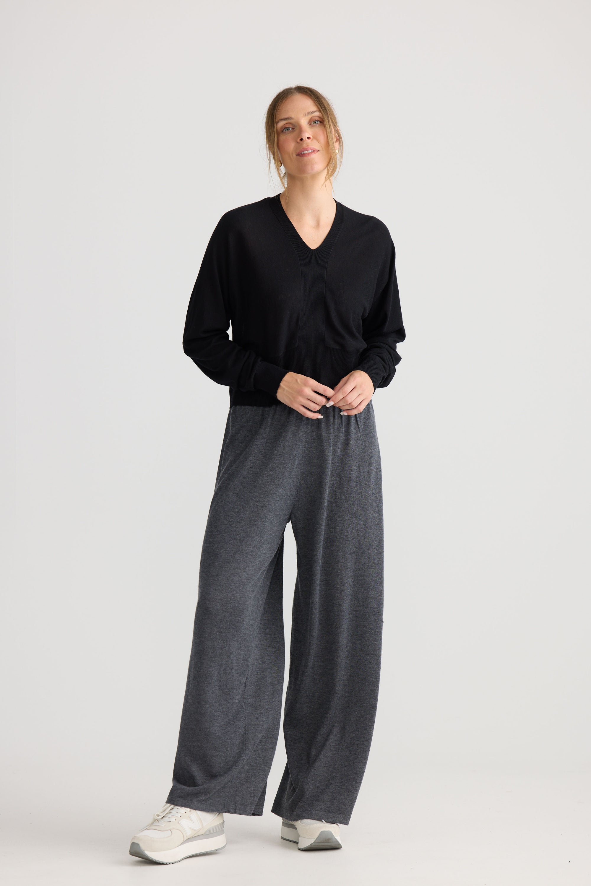 Model wearing Stillness Knit in black, styled for everyday wear.