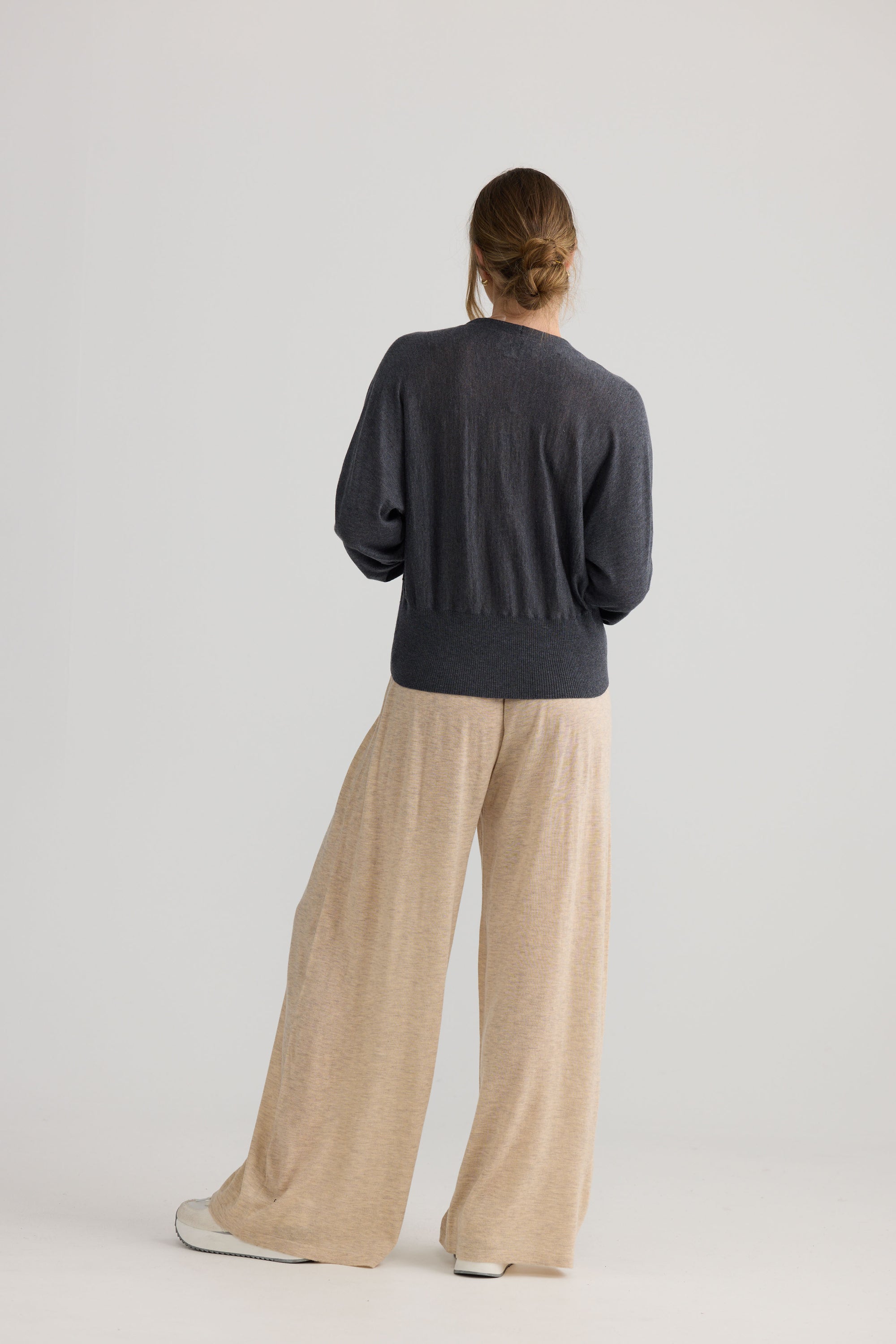 Stillness Knit in charcoal, shown on model.