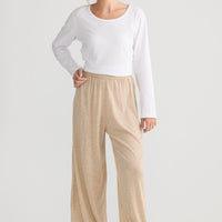 Model wearing Stillness Knit Pant in oat, styled for everyday wear.