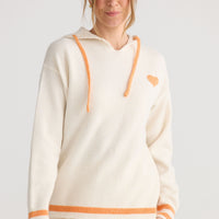 Bold Hearts Hoodie in off white, styled with a relaxed outfit.